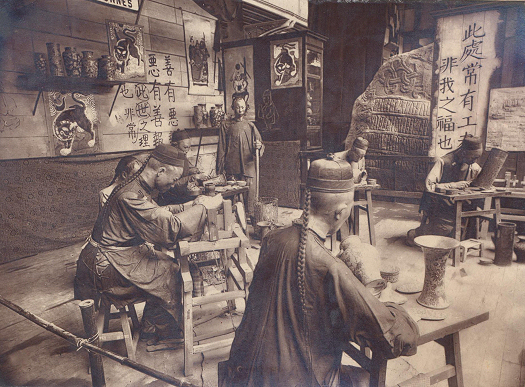 Replica of Harald Bluetooth’s rune stone at the entrance to the Danish exhibition in Paris, 1889. In the foreground are Chinese craftsmen. Photo: Musée d’Archeologie Nationale, Château de Saint-Germain.